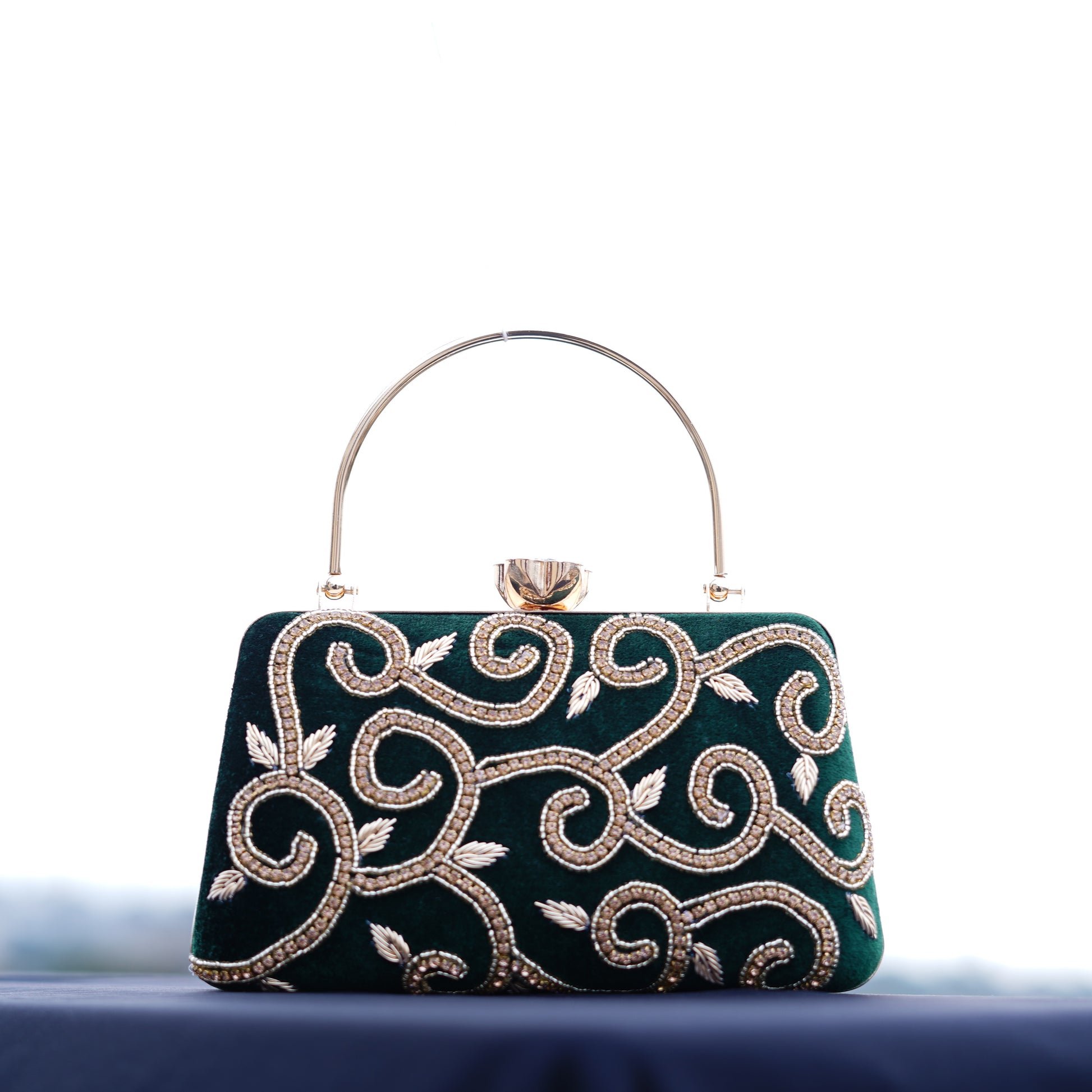 green designer clutch bag