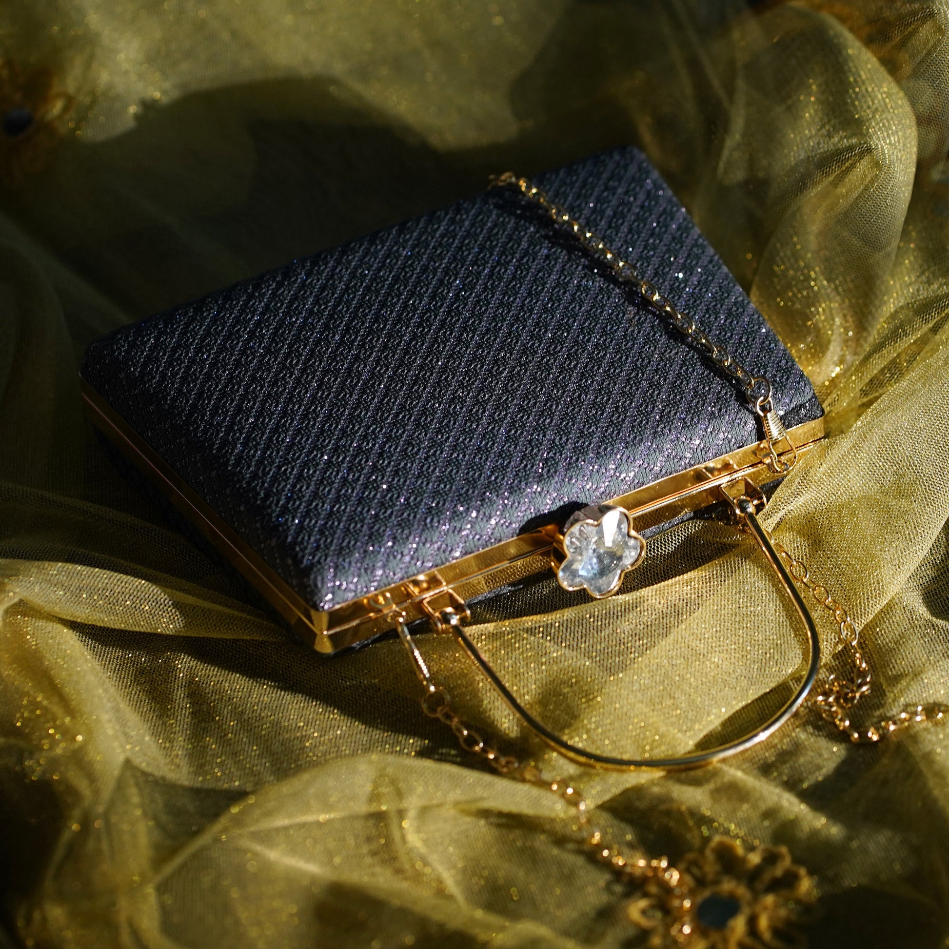 blue designer clutch bag